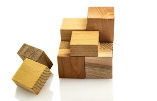 Puzzle cubes of wooden blocks isolated on white background. defocused close-up. Business success concept. Layout for presentation. photo