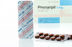 CHONBURI, THAILAND-JULY 11, 2023 Prenarpil tablet pills in brown blister pack. Clonazepam used to treat seizures, panic disorder, anxiety disorders. Benzodiazepines drug. Mental illness medication. photo