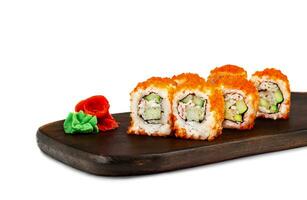 Traditional delicious fresh sushi roll on wooden board, isolate. Sushi roll with rice, tofu cheese, red flying fish caviar, crab meat and avocado. Sushi menu. Japanese, restaurant. Seafood, Asian photo