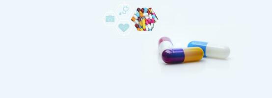Medicine and health, pharmaceutical care concept. Colorful capsule pills with heart rate, stethoscope, medical equipment bag symbol. Prescription drug. Health checkup and hospital. Cardiology doctor. photo