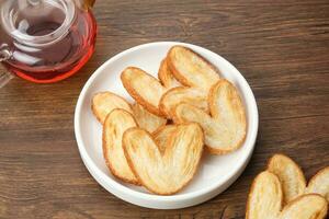 Butterfly Puff Pastry or Palmier Cookies with heart shape photo