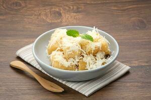 Fried cassava with cheese or singkong goreng keju, Indonesian traditional food. photo