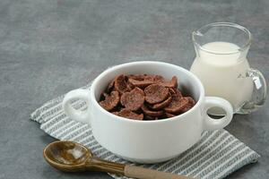 Bowl of cereal chocolate flavor, sweet crunchy photo