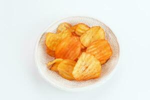 Potato Chips, served in bowl on white background. photo