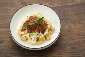 Tahu Campur, made from tofu, cabbage and bean sprouts served with peanut sauce. Indonesian traditional food photo