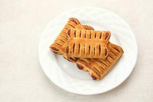 Puff Pastry stuffed with strawberry jam photo