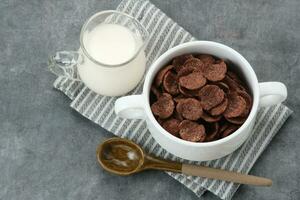 Bowl of cereal chocolate flavor, sweet crunchy photo