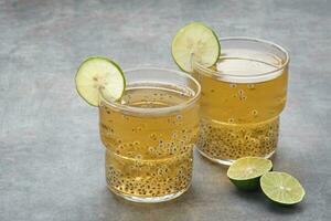 Chamomile tea with lime and basil seed photo