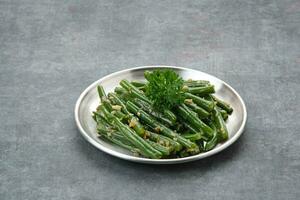 Tumis Buncis or Stir Fry String Bean with garlic and chilli powder photo