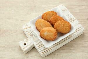 Jadah Goreng or Fried sticky rice cake, made from glutinous rice and grated coconut. Indonesian snack photo