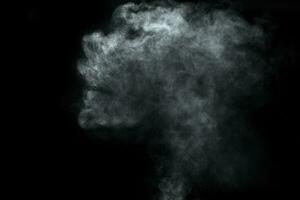 Abstract  powder or smoke isolated on black background photo