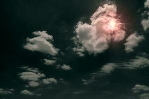 sun with textured cloud,Abstract white,isolated on black background photo