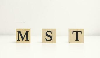 mst, marketing solutions and technologies text on cube blocks photo