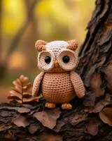 a crocheted owl is sitting on a tree branch generative ai photo