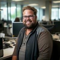 a man with a beard and glasses sitting in an office generative ai photo