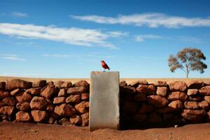 a red bird perched on a stone wall generative ai photo
