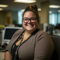 a smiling woman wearing glasses sits at a desk in an office generative ai photo