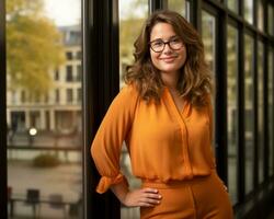 a woman with glasses and an orange blouse standing in front of a window generative ai photo