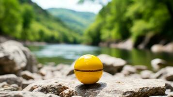 a yellow egg sitting on top of a rock by a river generative ai photo