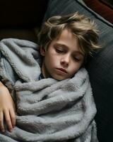 a young boy is wrapped up in a blanket generative ai photo