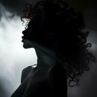 the silhouette of a woman with curly hair in the dark generative ai photo