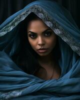 a beautiful woman wrapped in a blue shawl generative ai photo