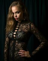 a beautiful young woman in a black lace bodysuit generative ai photo