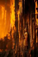a buddha statue stands in front of a cave generative ai photo