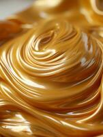 a close up of a golden liquid on top of a white surface generative ai photo