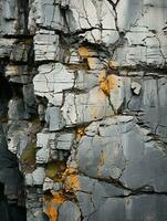 un cerca arriba de un rock pared con grietas en eso generativo ai foto