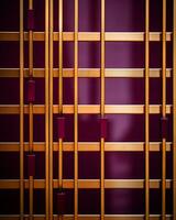 a purple and gold wall with bars on it generative ai photo