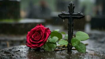 un rojo Rosa se sienta en parte superior de un lápida sepulcral en el lluvia generativo ai foto