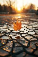 a single leaf sits on the ground in the middle of a cracked pavement generative ai photo