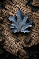 a single maple leaf laying on top of a piece of wood generative ai photo