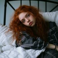 a woman with red hair laying on a bed generative ai photo