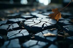 cracked pavement with a leaf on the ground generative ai photo