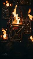 fire lit lanterns hanging from chains in a dark room generative ai photo