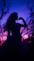 silhouette of a woman in a dress against a purple sky generative ai photo