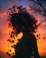 silhouette of a woman with leaves in her hair at sunset generative ai photo