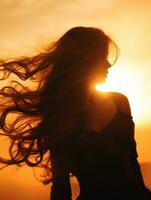 silhouette of woman with long hair blowing in the wind at sunset generative ai photo