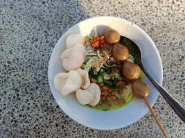 Indonesian chicken rice porridge named bubur ayam in the morning photo