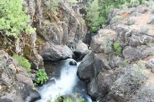 Natural Rocky Waterfall Landscape, Montgomery Creek Falls, California, USA photo
