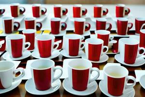 a table with many red and white cups and saucers. AI-Generated photo