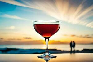 un vaso de rojo vino en un mesa en frente de el océano. generado por ai foto