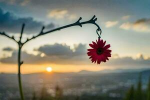 a red flower hanging from a branch at sunset. AI-Generated photo