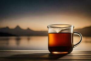 un taza de té se sienta en un de madera mesa en frente de un lago. generado por ai foto
