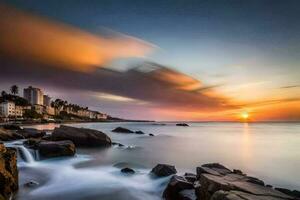 un puesta de sol terminado el Oceano con rocas y agua. generado por ai foto