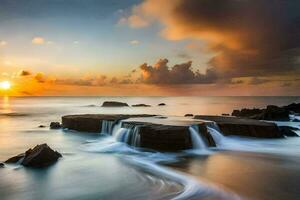 un hermosa puesta de sol terminado el Oceano con rocas y agua. generado por ai foto