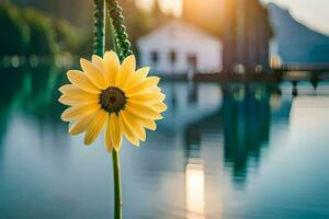 a yellow flower is standing in front of a lake. AI-Generated photo