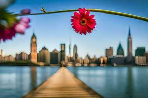 a pink flower is on a wooden pier with a city in the background. AI-Generated photo